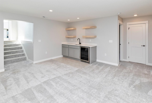 3309 NW Reinhart Dr, Ankeny, IA 50023 - indoor wet bar featuring wine cooler, light carpet, stairway, recessed lighting, and baseboards