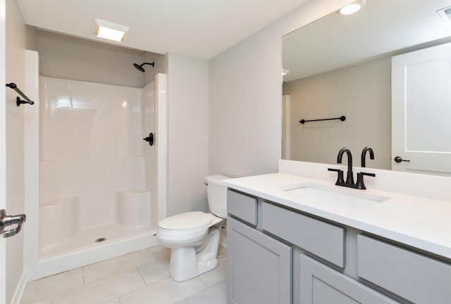 3309 NW Reinhart Dr, Ankeny, IA 50023 - bathroom with toilet, vanity, tile patterned floors, and a shower