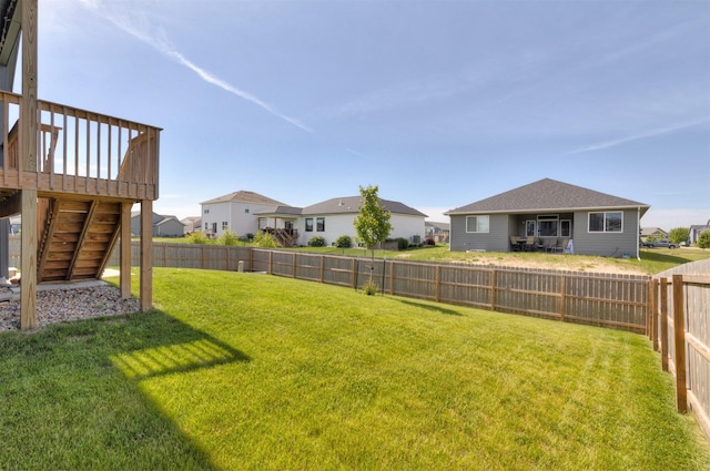 3309 NW Reinhart Dr, Ankeny, IA 50023 - view of yard featuring stairs, a deck, and a residential view