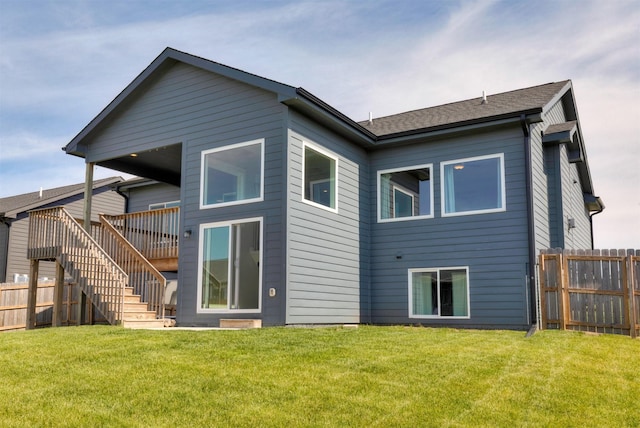 3309 NW Reinhart Dr, Ankeny, IA 50023 - rear view of house with stairway and a wooden deck