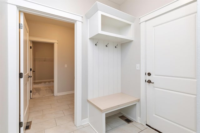 3309 NW Reinhart Dr, Ankeny, IA 50023 - mudroom with baseboards and light tile patterned flooring