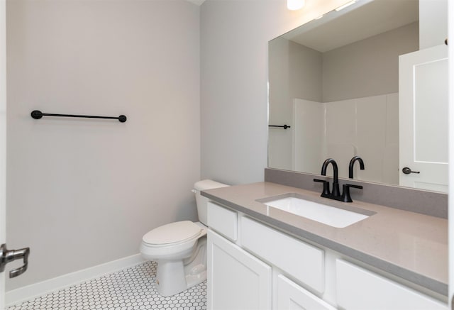 3309 NW Reinhart Dr, Ankeny, IA 50023 - full bathroom with vanity, toilet, baseboards, and a shower
