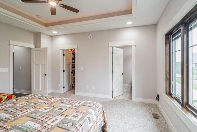 2658 SW 20th Cir, Ankeny, IA 50023 - bedroom with a raised ceiling, light colored carpet, recessed lighting, a spacious closet, and ensuite bath
