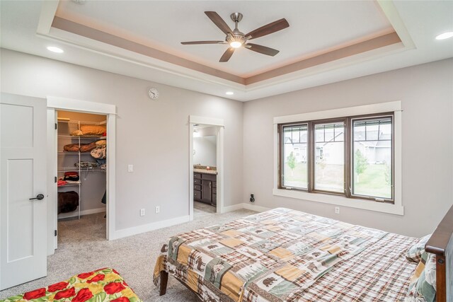 2658 SW 20th Cir, Ankeny, IA 50023 - bedroom featuring a tray ceiling, a spacious closet, light carpet, recessed lighting, and a closet