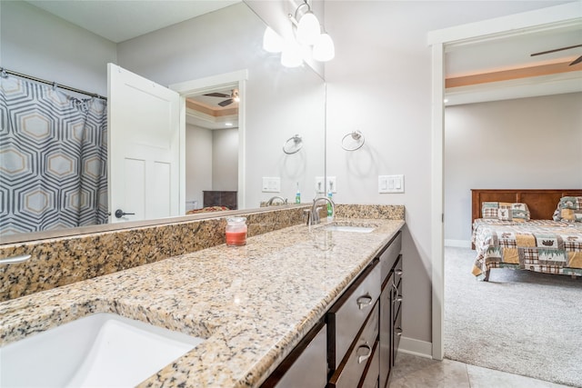 2658 SW 20th Cir, Ankeny, IA 50023 - ensuite bathroom with a ceiling fan, double vanity, and baseboards