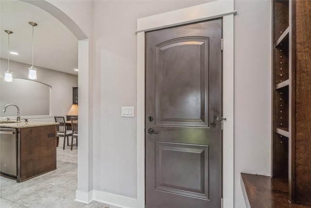 2658 SW 20th Cir, Ankeny, IA 50023 - foyer entrance featuring arched walkways, baseboards, recessed lighting, and light tile patterned flooring