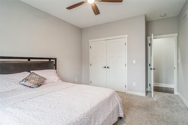 2658 SW 20th Cir, Ankeny, IA 50023 - bedroom with carpet floors, a closet, baseboards, and ceiling fan