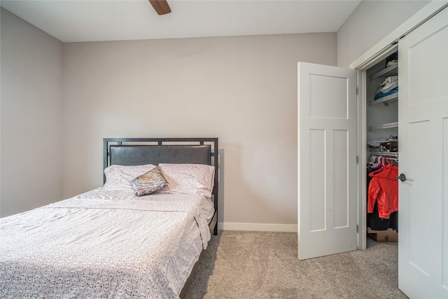 2658 SW 20th Cir, Ankeny, IA 50023 - carpeted bedroom with a closet, a walk in closet, a ceiling fan, and baseboards