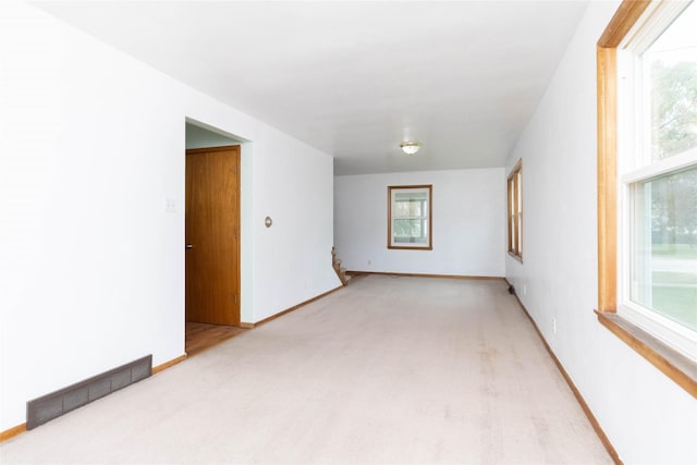 221 W Division St, Colfax, IA 50054 - empty room with light carpet and baseboards