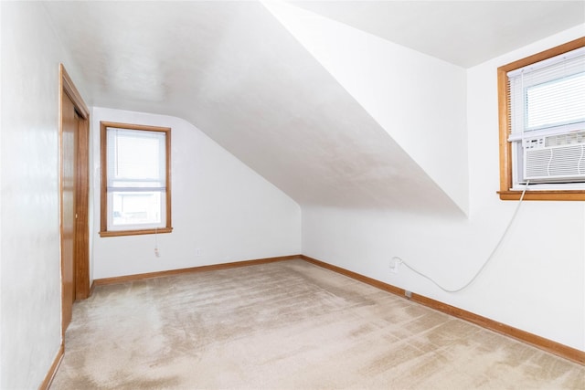 221 W Division St, Colfax, IA 50054 - bonus room with vaulted ceiling, baseboards, carpet, and cooling unit