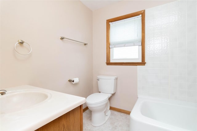 221 W Division St, Colfax, IA 50054 - bathroom featuring baseboards, toilet, vanity, and tile patterned flooring