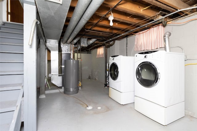 221 W Division St, Colfax, IA 50054 - unfinished basement featuring water heater, washing machine and dryer, and stairs