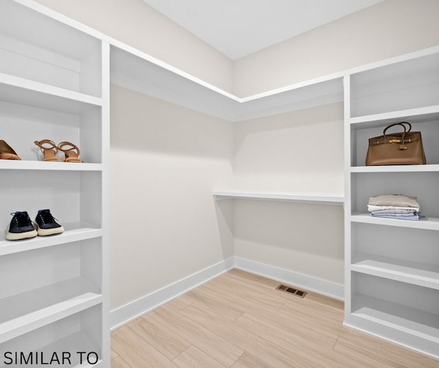 4641 179th St, Urbandale, IA 50323 - walk in closet with wood finished floors