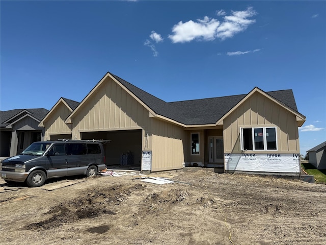 4641 179th St, Urbandale, IA 50323 - property in mid-construction with an attached garage, board and batten siding, and a shingled roof
