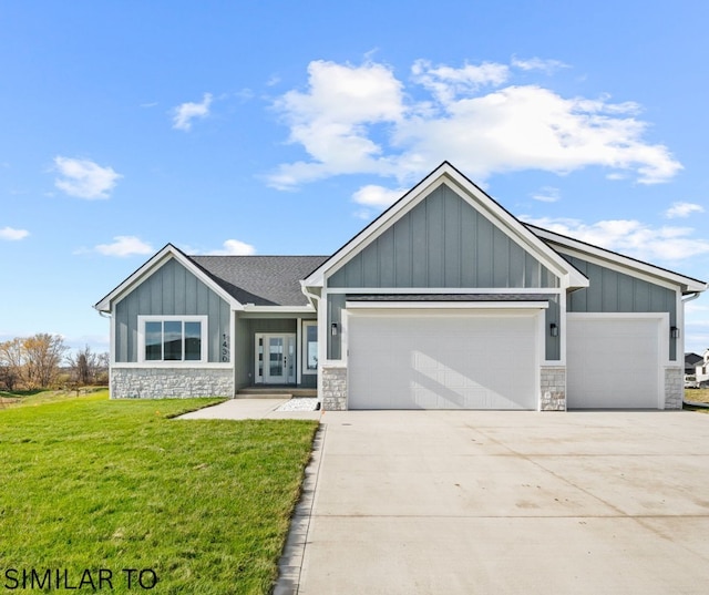 4641 179th St, Urbandale, IA 50323 - craftsman-style house with stone siding, a garage, and board and batten siding