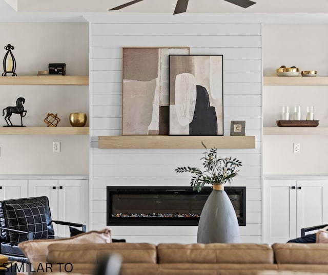 4641 179th St, Urbandale, IA 50323 - living room with a large fireplace, ceiling fan, and built in features