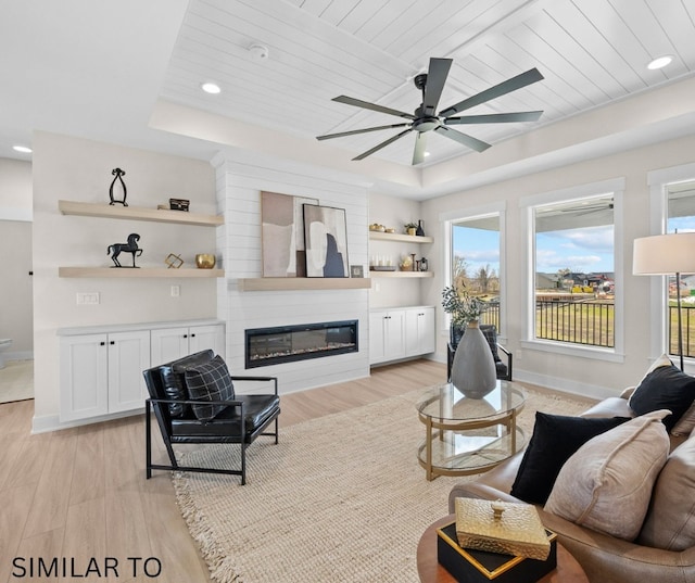 4641 179th St, Urbandale, IA 50323 - living area with ceiling fan, light wood finished floors, a glass covered fireplace, baseboards, and recessed lighting