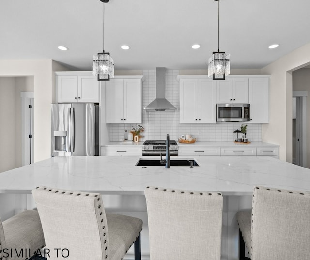 4641 179th St, Urbandale, IA 50323 - kitchen with stainless steel appliances, wall chimney exhaust hood, a chandelier, tasteful backsplash, and recessed lighting