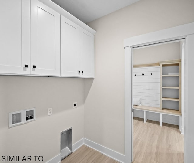 4641 179th St, Urbandale, IA 50323 - washroom with cabinet space, light wood finished floors, electric dryer hookup, baseboards, and washer hookup
