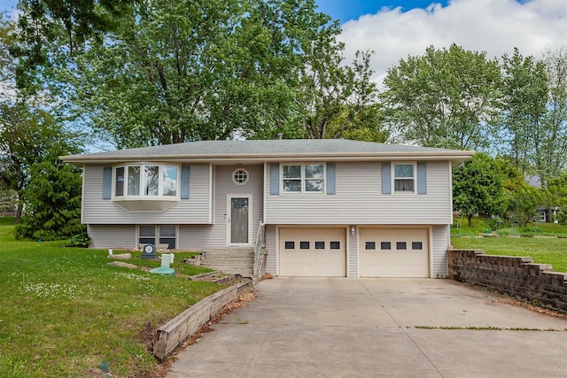 1406 110th Pl, Knoxville, IA 50138 - raised ranch featuring an attached garage, concrete driveway, and a front yard