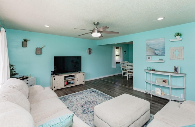 1406 110th Pl, Knoxville, IA 50138 - living room featuring ceiling fan, wood finished floors, recessed lighting, a textured ceiling, and baseboards