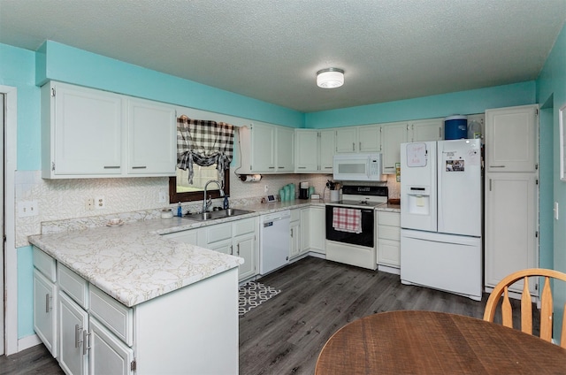 1406 110th Pl, Knoxville, IA 50138 - kitchen with white appliances, a sink, dark wood finished floors, light countertops, and a textured ceiling