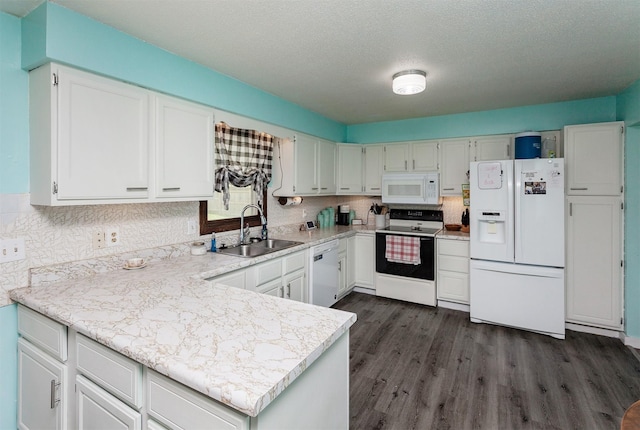 1406 110th Pl, Knoxville, IA 50138 - kitchen with white appliances, a sink, dark wood finished floors, light countertops, and a textured ceiling