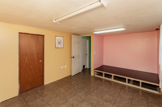 1406 110th Pl, Knoxville, IA 50138 - empty room with a textured ceiling