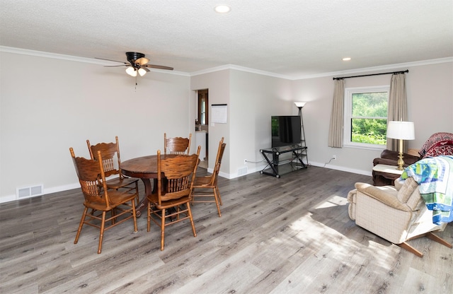 936 15th St, West Des Moines, IA 50265 - dining area featuring wood finished floors, a ceiling fan, crown molding, baseboards, and recessed lighting