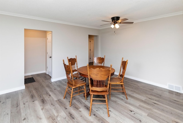 936 15th St, West Des Moines, IA 50265 - dining area featuring ceiling fan, wood finished floors, crown molding, and baseboards