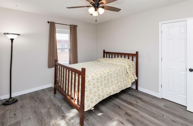 936 15th St, West Des Moines, IA 50265 - bedroom featuring wood finished floors, baseboards, and a ceiling fan