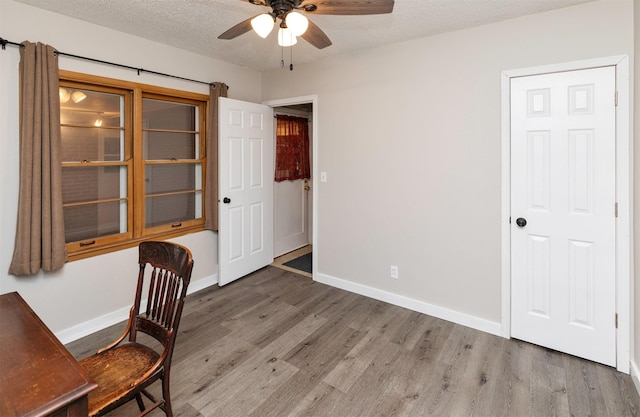936 15th St, West Des Moines, IA 50265 - unfurnished office featuring wood finished floors, a ceiling fan, a textured ceiling, and baseboards
