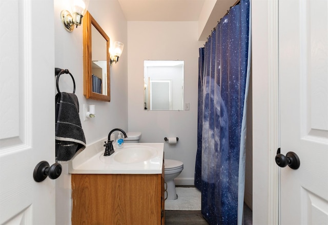 936 15th St, West Des Moines, IA 50265 - full bathroom with vanity, toilet, and a shower with shower curtain