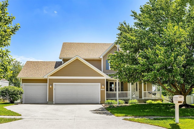 5525 SE 29th Ct, Des Moines, IA 50320 - view of front of property featuring a garage, driveway, a porch, a shingled roof, and a front lawn