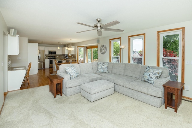 5525 SE 29th Ct, Des Moines, IA 50320 - carpeted living area with ceiling fan