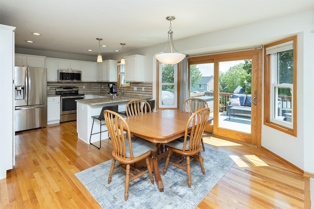 5525 SE 29th Ct, Des Moines, IA 50320 - dining room featuring light wood-style flooring, recessed lighting, and baseboards