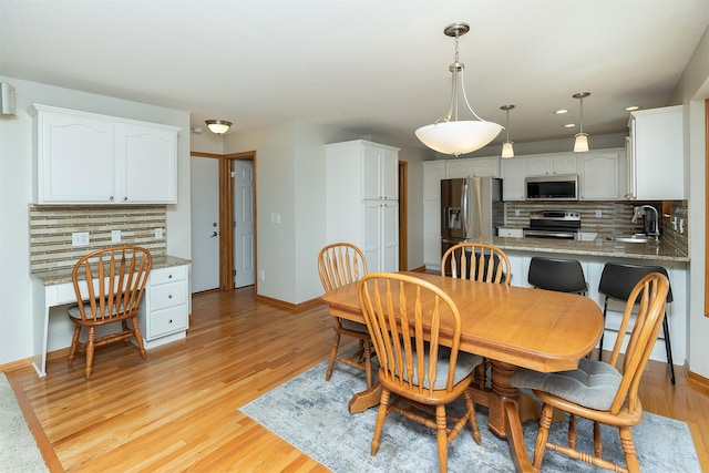 5525 SE 29th Ct, Des Moines, IA 50320 - dining area with light wood-style flooring, baseboards, an office area, and recessed lighting