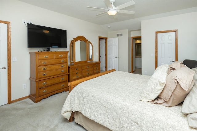 5525 SE 29th Ct, Des Moines, IA 50320 - bedroom featuring light carpet, vaulted ceiling, ceiling fan, ensuite bath, and baseboards