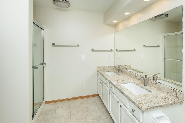 5525 SE 29th Ct, Des Moines, IA 50320 - full bath with double vanity, baseboards, a shower with door, recessed lighting, and tile patterned floors