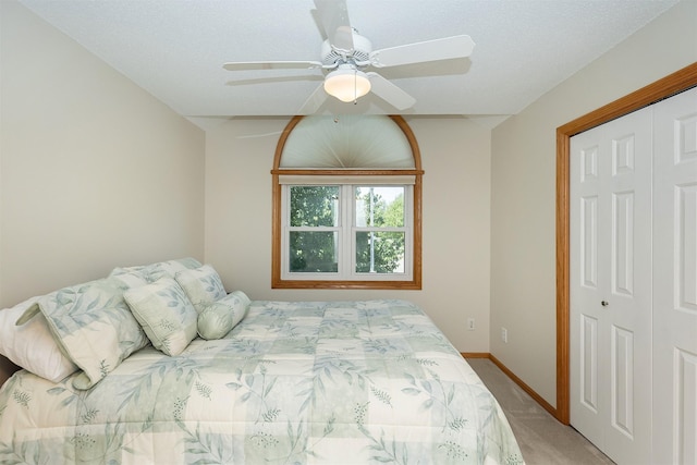 5525 SE 29th Ct, Des Moines, IA 50320 - bedroom featuring light colored carpet, a closet, baseboards, and a ceiling fan