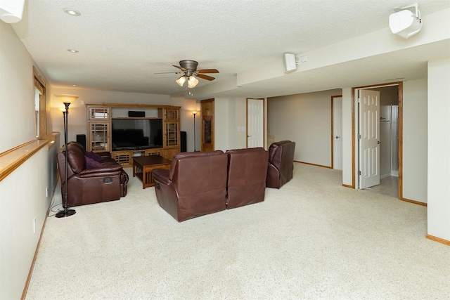 5525 SE 29th Ct, Des Moines, IA 50320 - living area with light carpet, baseboards, a textured ceiling, a ceiling fan, and recessed lighting