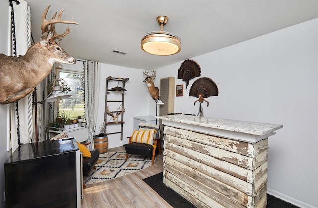 623 W Front St, Stuart, IA 50250 - living area with wood finished floors and baseboards