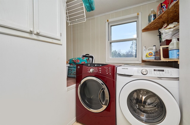 623 W Front St, Stuart, IA 50250 - laundry room with separate washer and dryer, cabinet space, and ornamental molding