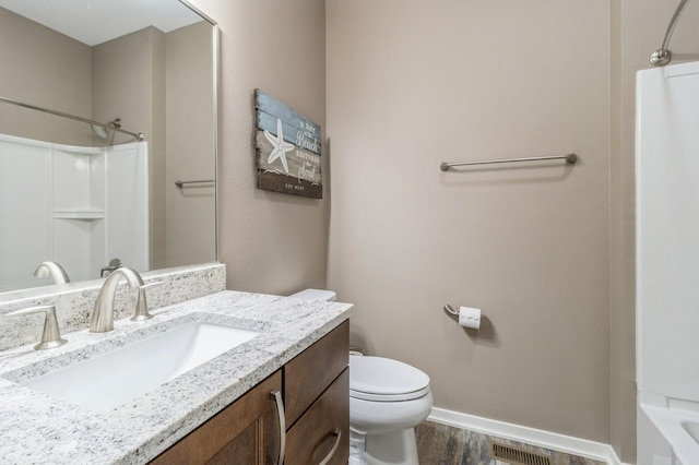 5645 Prairie Grass Dr, Johnston, IA 50131 - bathroom with vanity, wood finished floors, toilet, baseboards, and shower / tub combination