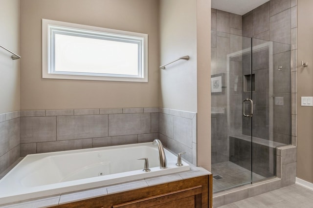5645 Prairie Grass Dr, Johnston, IA 50131 - bathroom featuring a shower stall and a jetted tub