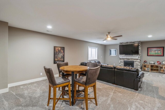 5645 Prairie Grass Dr, Johnston, IA 50131 - carpeted dining room with ceiling fan, a fireplace, baseboards, and recessed lighting