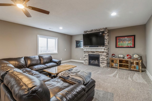 5645 Prairie Grass Dr, Johnston, IA 50131 - carpeted living area with baseboards, a stone fireplace, ceiling fan, and recessed lighting