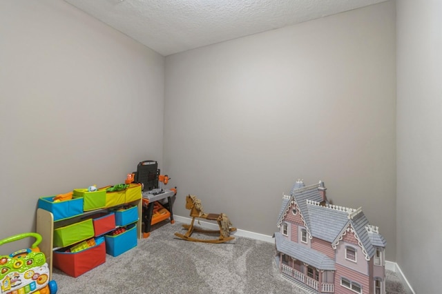 5645 Prairie Grass Dr, Johnston, IA 50131 - game room with carpet flooring, baseboards, and a textured ceiling