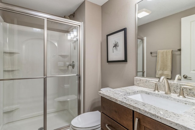 5645 Prairie Grass Dr, Johnston, IA 50131 - bathroom featuring toilet, a stall shower, and vanity