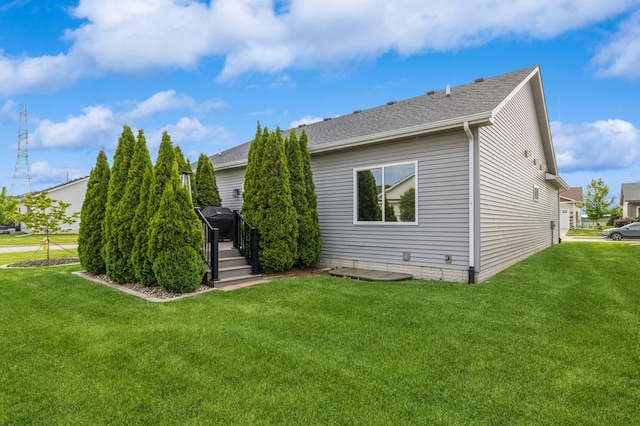 5645 Prairie Grass Dr, Johnston, IA 50131 - rear view of property with a yard, a deck, and a shingled roof